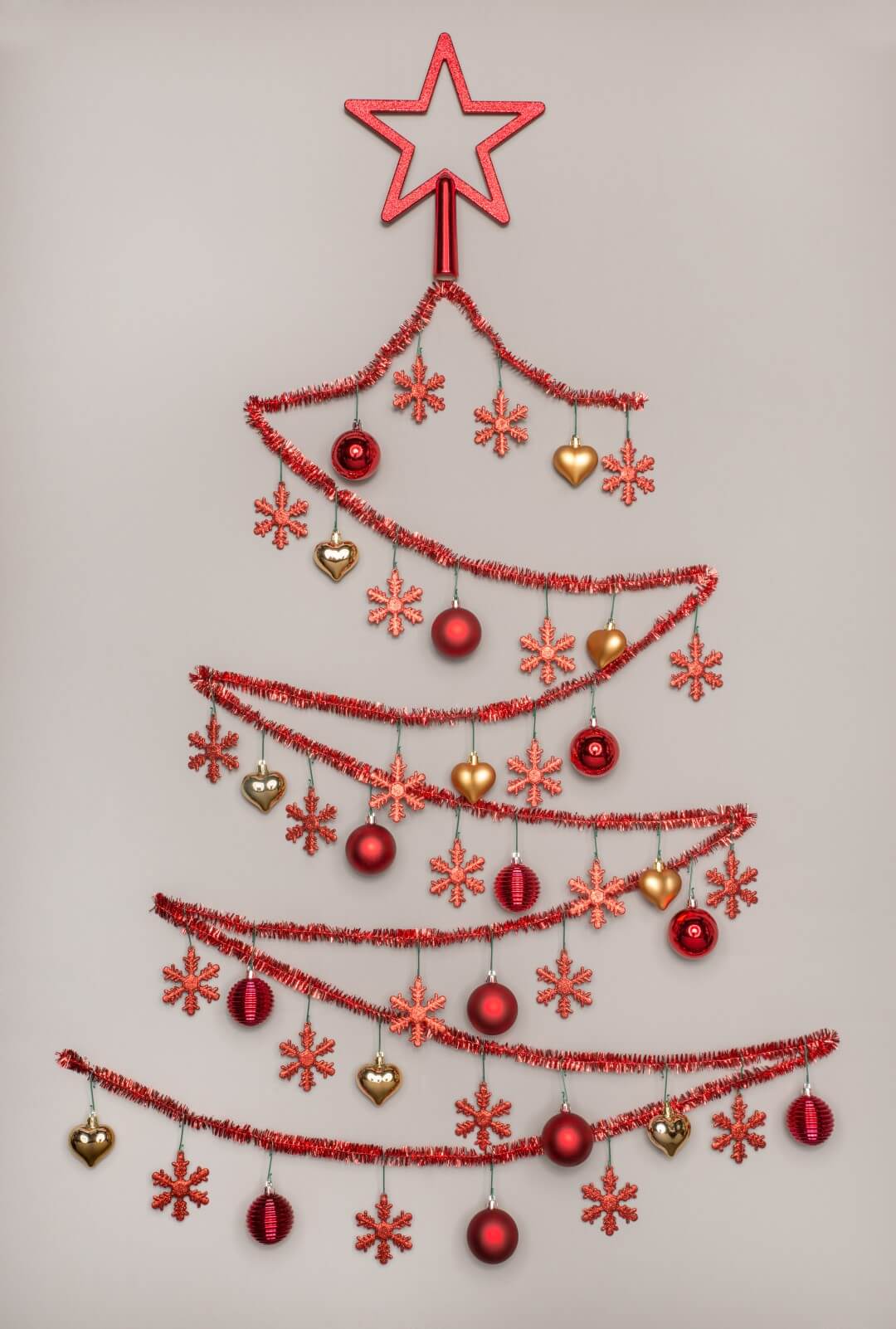 Tinsel Christmas tree on the wall