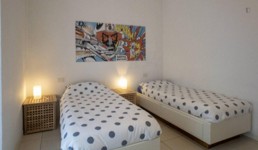 Bed in a twin bedroom close to Precotto metro station